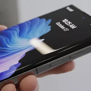 Samsung Galaxy S25 Edge smartphone on a clean reflective surface